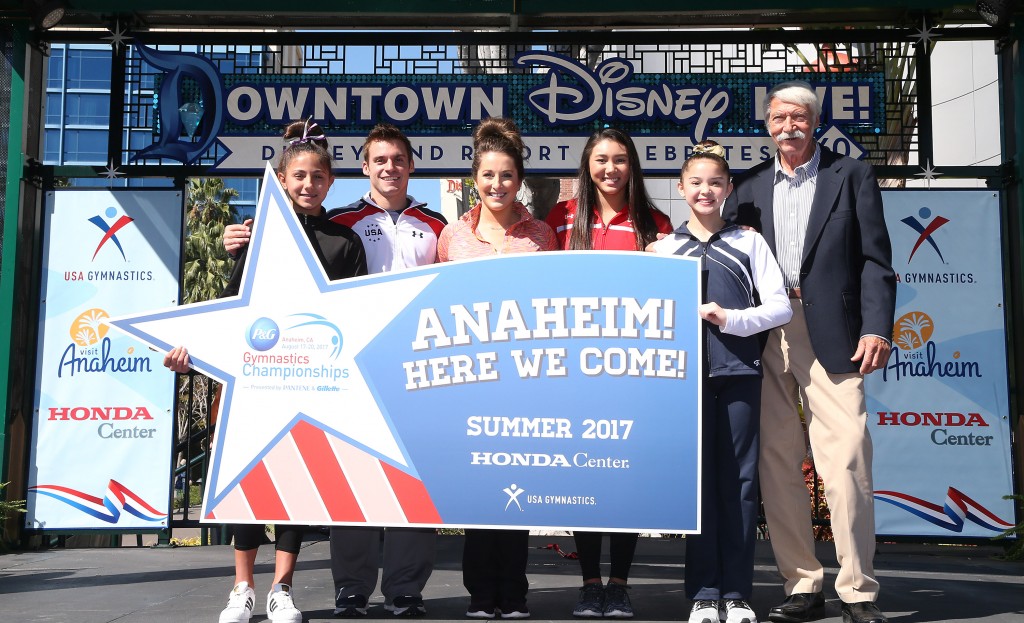 (March 8, 2016) - (From left) Gymnasts 2013-15 U.S. menÕs all-around champion Sam Mikulak, 2004 Olympic all-around champion Carly Patterson, 2012 Olympic team gold medalist Kyla Ross and legendary gymnastics coach Bela Karolyi stand with two, young Orange County gymnasts, holding the newly revealed logo for the 2017 P&G Gymnastics Championships during a ceremony at Downtown Disney in Anaheim, Calif., on Tuesday, March 8, 2016. Karolyi and the athletes appeared as special guests during the ceremony, when USA Gymnastics announced that the 2017 P&G Gymnastics Championships, the national championships for menÕs and womenÕs gymnastics, will be held in the city of Anaheim for the first time, from August 17 Ð 20, 2017, in the Honda Center. (Paul Hiffmeyer/Disneyland Resort)